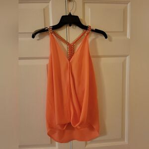 Pastel sleeveless top with gold braided strap in back